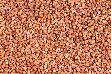 Background of dried buckwheat with whole large kernel / Diet concept / Close up