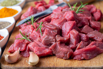 Heap of raw chopped beef isolated on cutting board