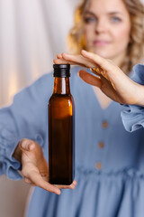 Fototapeta premium alternatives, beautiful, beauty, bottle, business, dairy, dark glass, diet, eco, environmental friendliness, essential, european, extract, female, food, girl, glass, glass bottle, green, healthy, hold
