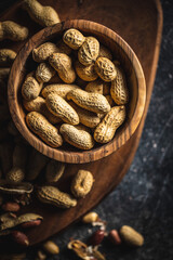 Roasted peanuts. Tasty groundnuts in bowl.