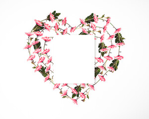 Heart shape frame made of pink margarita flowers with note paper and copy space, happy valentine's day, mother's day, flower background, flat lay, top view