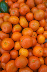fresh mandarin oranges on market. oranges fresh fruit. clementines. Ripe tangerines