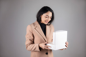 happy woman holding gift box