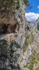 Tunnel pathway in Cares River canyon in Asturias. The Cares Route, placed in the very heart of Picos de Europa National Park, also known as “La Garganta Divina” (The Divine Gorge).