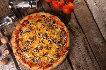 Delicious pizza and herbal tomato ingredients on a wooden background. Raw pizza top view. With copy space for text. Flat lay. Banner