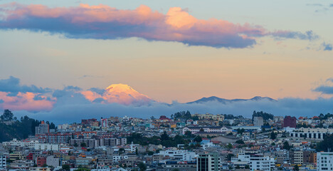 Fototapeta na wymiar Quito aerial sunset panorama with snowcapped Cayambe volcano peak, Andes mountains, Ecuador.