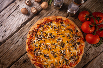 Delicious pizza and herbal tomato ingredients on a wooden background. Raw pizza top view. With copy space for text. Flat lay. Banner