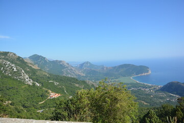 Fototapeta na wymiar Panoramic view with mountains and coastline of Montenegro near Kotor with sea and beautiful blue sky in summer
