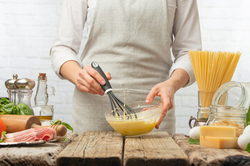 Chef Preparing Sauce For Carbonara Pasta Recipe Book And Cooking Food