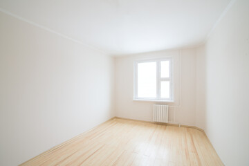 Empty white room with window.