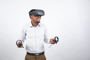 young black man smiling while using a vr headset and controllers