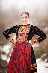 Young beautiful slovak woman in traditional dress. Slovak folklore