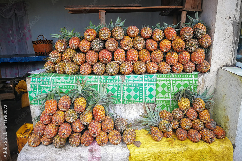 Poster Pile of fresh pineapples on display at street market in Madagascar