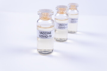 three ampoules with the Covid-19 vaccine are in a row