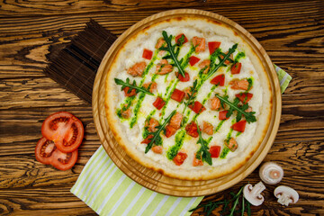 pizza with salmon and tomatoes on wood background for restaurant menu1