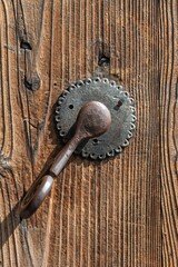 Old Antique Rusty Metal Doorknob, Handle on a wooden door