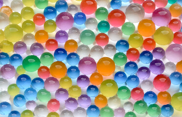 Abstract multicolored background with hydrogel beads texture. Water absorbent balls