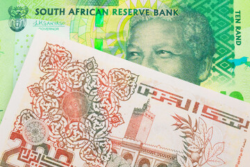 A macro image of a shiny, green 10 rand bill from South Africa paired up with a beige 200 Algerian dinar bank note.  Shot close up in macro.