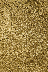 Gold defocused glitter.  Bokeh light of gold glitters background. 