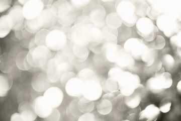 Silver defocused glitter.  Bokeh light of gold glitters background. 