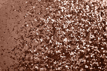 Rose gold defocused glitter.  Bokeh light of gold glitters background. 