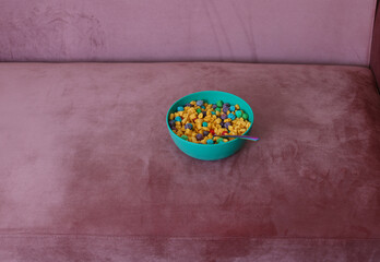 bowl cereal sitting on the couch