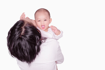 An Asian male baby is happy when his mother is holding him.Focus on the