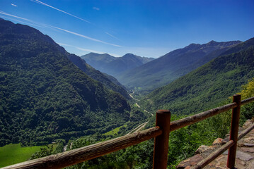 Fototapeta na wymiar Mountain landscape in the French Pyrenees with wooden railings in the foreground