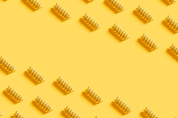 Wholegrain and healthy Italian pasta pattern on a modern fashionable yellow background. text copy....