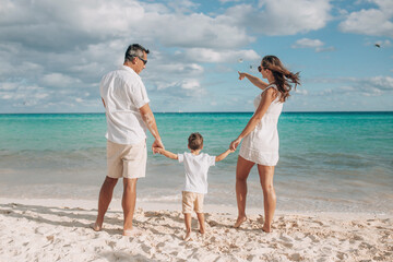 Happy family on the beach. Family vacation on the sea coast