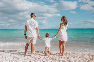 Happy family on the beach. Family vacation on the sea coast
