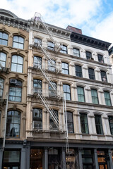 Fototapeta na wymiar Windows on old apartment buildings in SoHo, New York City