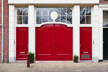 a vibrant red door on a luxury home in a city
