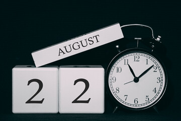 Important date and event on a black and white calendar. Cube date and month, day 22 August. Summer...