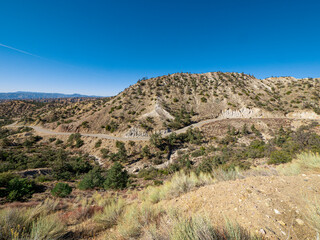 Wide angle view of California Mountain Landscape with Winding Road Daytime