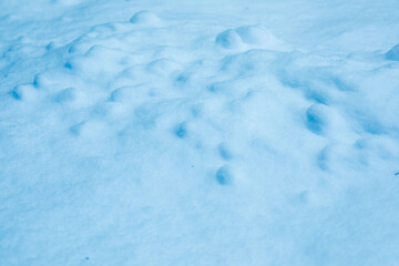 Surface of pure white snow with bumps.Winter image.