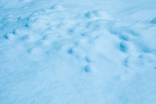 Surface of pure white snow with bumps.Winter image.