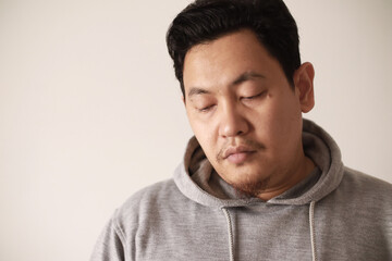 Fototapeta premium Sad depressed anxiety Asian man thinking contemplating bad thing happened in his life, stress exhausted feeling down expression, financial or relationship problem