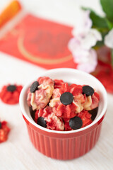 Homemade red and purple Chinese New Year bite size butter cookies