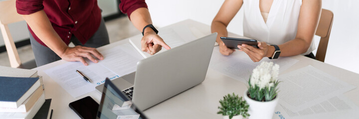 Young woman and man studying for a test or exam Tutor books with friends catching up and learning, education and school concept.