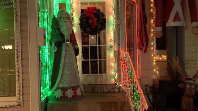 View of Santa Clause at Front Entrance of a Christmas House