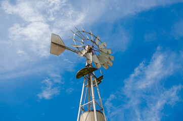 Field photo of a Windmill with sky background