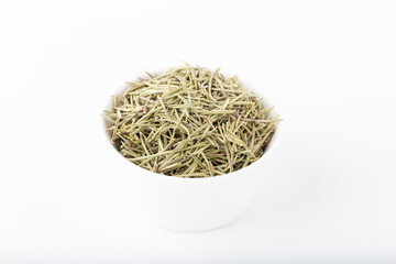 Dried rosemary in white bowl on white background. Dried rosemary isolated on white.
