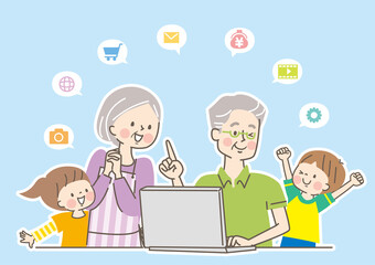 笑顔の3世代家族とパソコン
