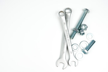Naklejka premium wrenches and a few bolts and nuts to secure the products