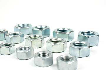 large metal nuts on a white background close up