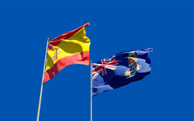Flags of Spain and Cayman Islands.