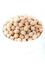 Dried chickpea beans in white bowl isolated on white background.
