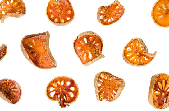 Pile of dried bael fruit isolated on white background