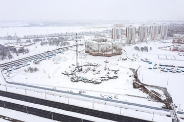 winter cityscape, aerial view. construction of new buildings in suburb residential area. Minsk, Belarus